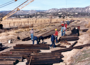 All-volunteer crews laying track from the SD&A main line to the new shop building
