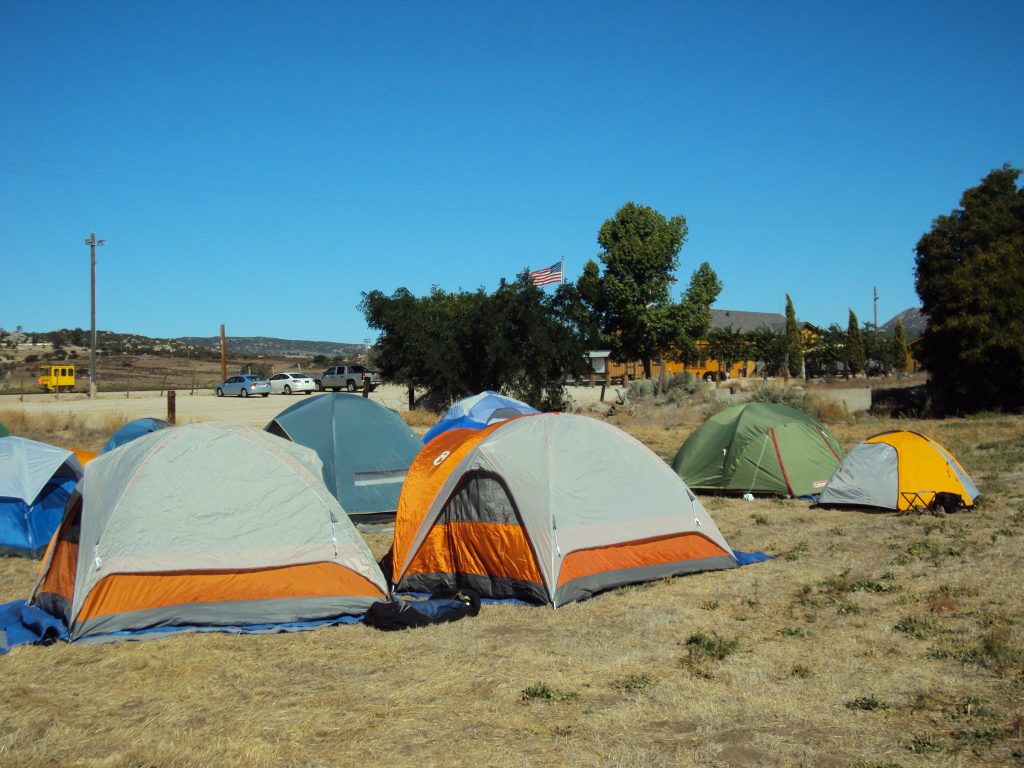 Scouts from Troop 959 pitch their tents just a few steps away from the historic Campo Depot, built in 1917